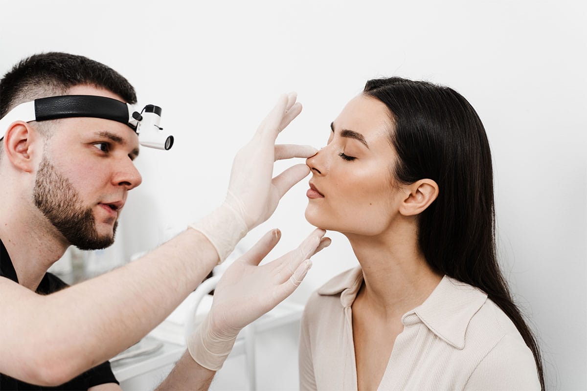 woman receiving a septoplasty consultation in New York City