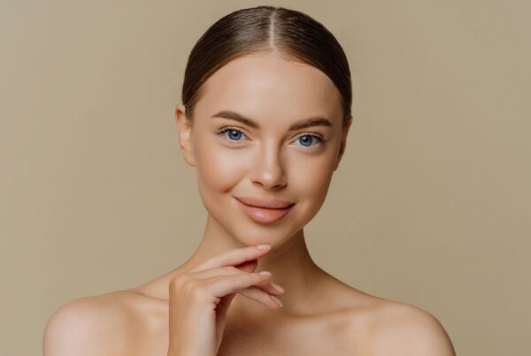 woman smiling after getting a lower facelift in New York City