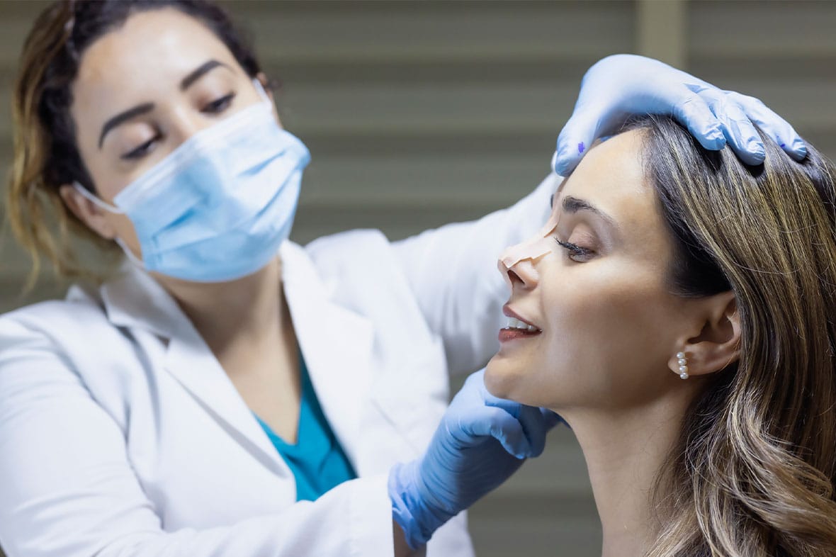 woman at a consultation in New York City for a revision rhinoplasty