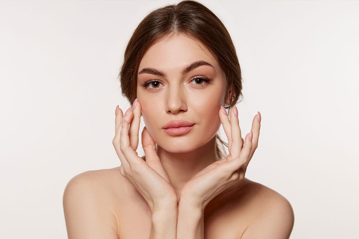 woman after her facelift and fillers in NYC